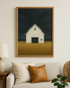 Framed artwork of a barn on a wall above a sofa with decorative pillows.