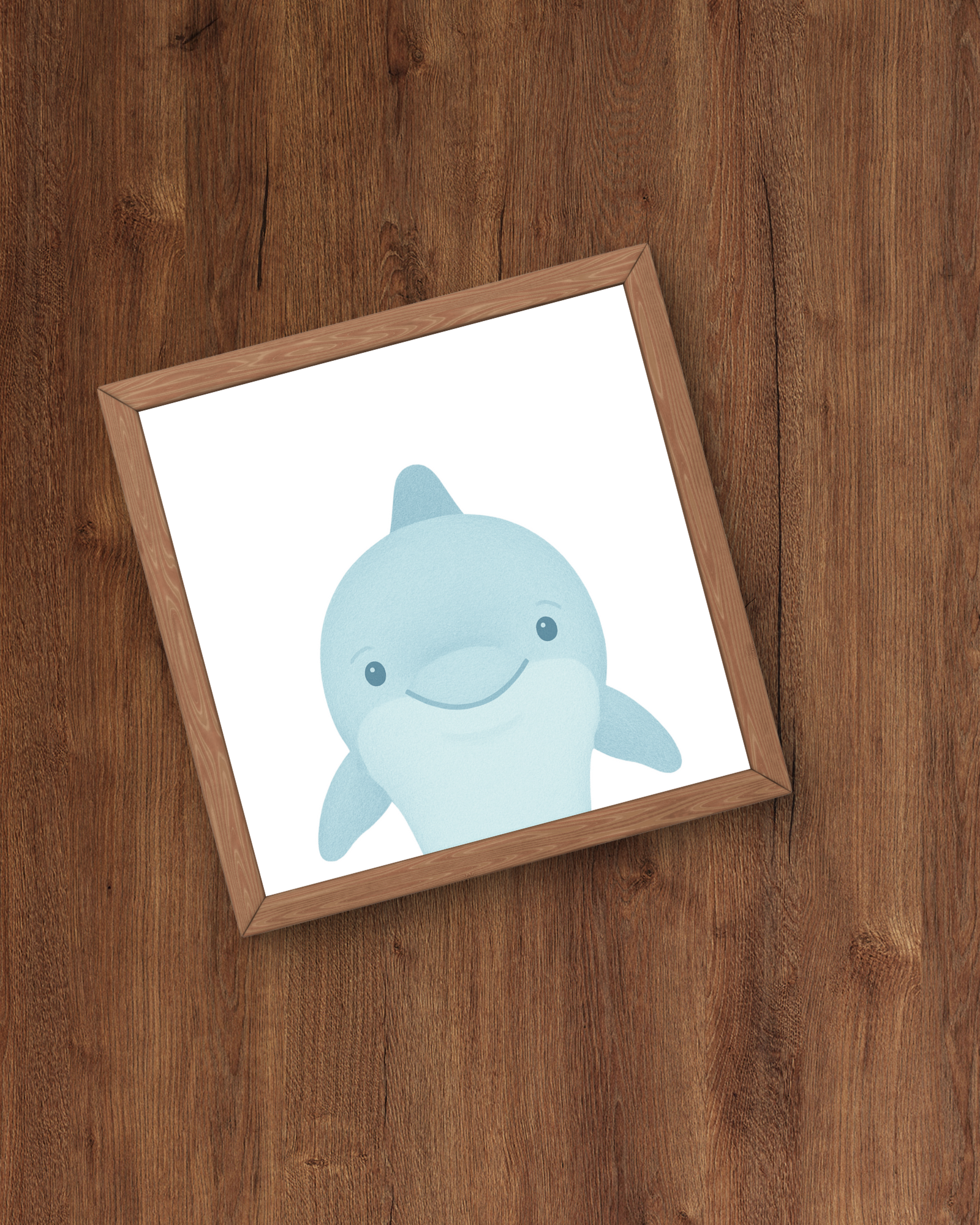 Framed picture of a blue dolphin on a wooden surface