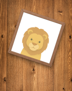 Framed illustration of a lion on a wooden surface