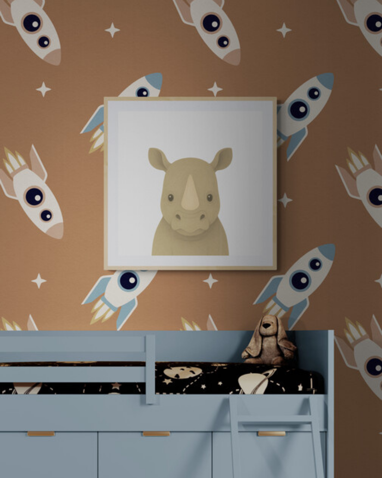 Framed picture of a rhino on wallpaper with rocket pattern