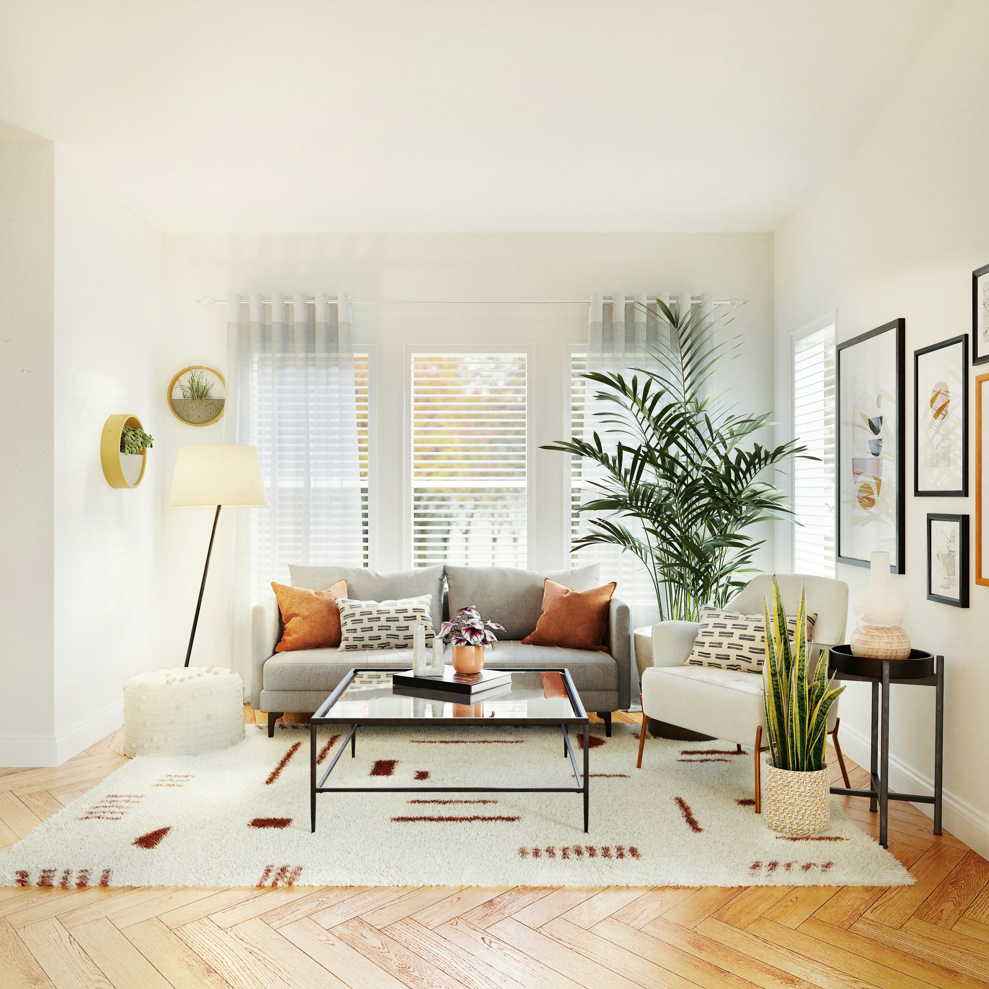 Modern living room with a gray sofa, wall art, coffee table, and decorative elements.